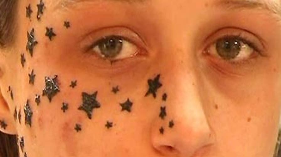 Scarred by 56 Tattoos