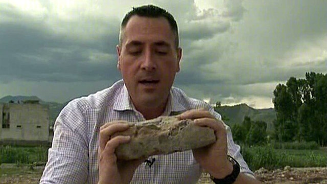 FNC reporter chisels out brick from Bin Laden compound