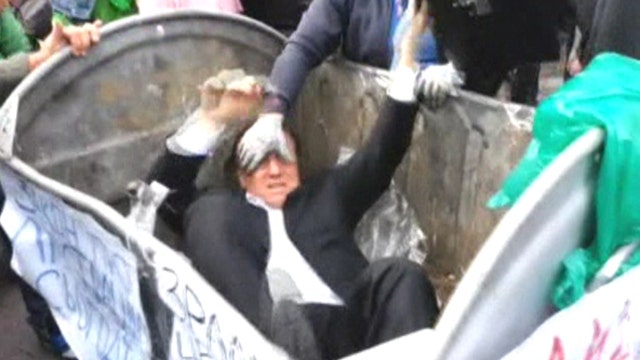 Angry mob throws Ukrainian parliament deputy in trash can