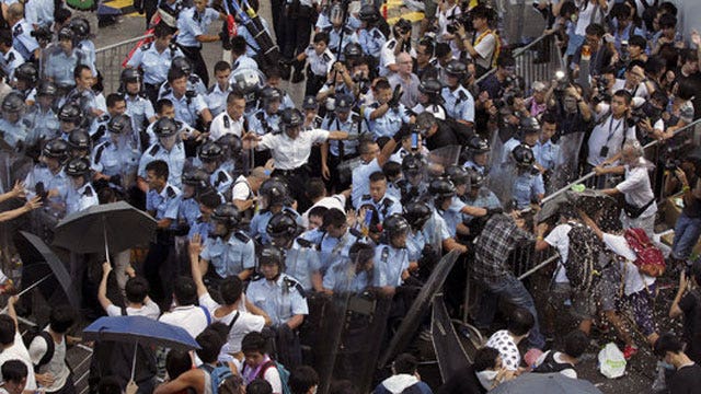 Police clash with democracy demonstrators in Hong Kong