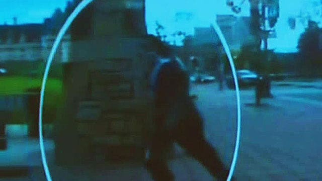 Surveillance video shows gunman running into parliament