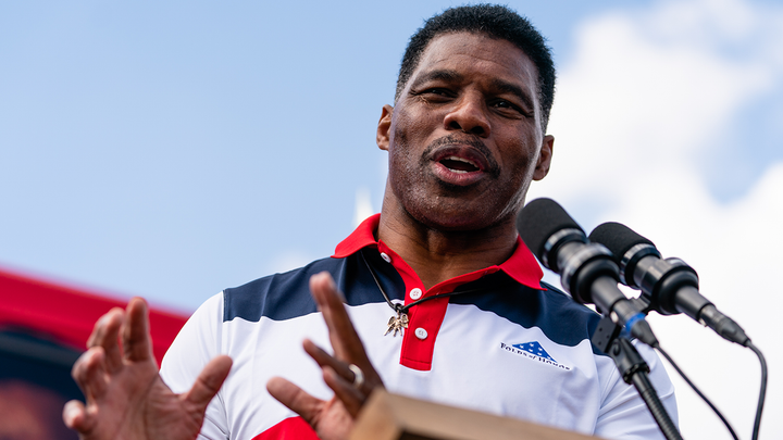 Georgia US Senate candidate Herschel Walker attends a bus stop tour