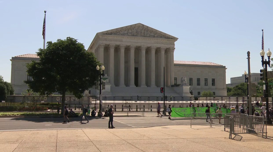 Protesters gather outside the Supreme Court building