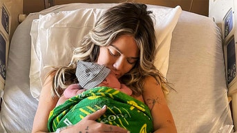 Girlfriend of late college football player gives birth to son
