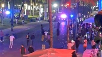 Deadly shooting in Florida hotspot sends crowds scrambling for cover