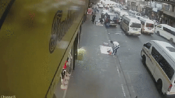 Horror moment road explodes, sending cars and buses flying during rush hour