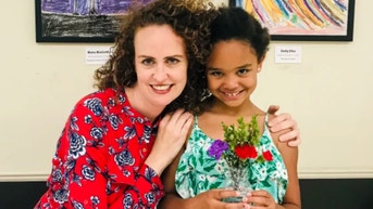 White mother sues airline after employee allegedly accused her of trafficking biracial child