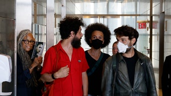 New York professor who threatened reporter with weapon learns her fate