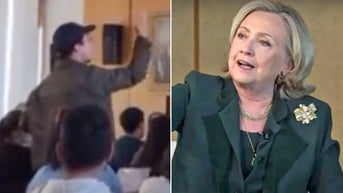 Clinton confronted by agitator over Biden's 'warmongering' speech