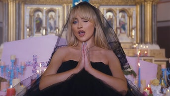 Pop star absolves herself of sin after raunchy church music video outrages Christians