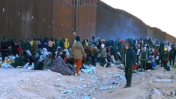 Stunning images show border crossing overrun by massive surge of male migrants