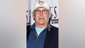 Chevy Chase FALLS off stage