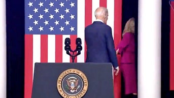 Video of Biden being escorted offstage by first lady catches fire on social media