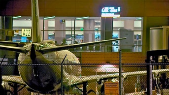 Man found dead at airport after climbing into plane engine