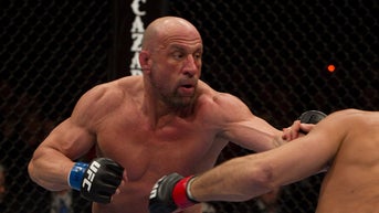 UFC legend 'battling for his life' after carrying parents out of house fire, daughter says