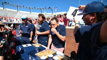 Hot dog eating champion Joey Chestnut puts on a show at Ole Miss spring football gam