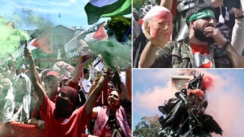 Anti-Israel agitator in Hamas headband holds up bloodied Biden mask near White House