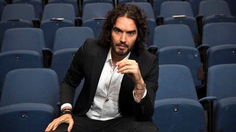 Russell Brand says only one presidential candidate will protect democracy, freedom