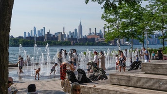 Americans struggle to stay cool as historic temperatures roast the Northeast