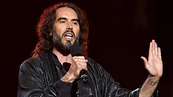 Russell Brand calls Biden’s exit from presidential race an ‘extraordinary masquerade’