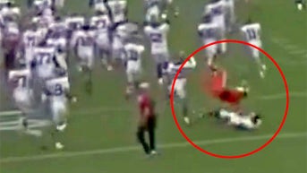 Cheerleader accidentally takes out college football star in embarrassing mishap - Fox News