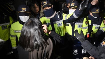 South Korean police confront woman - Fox News