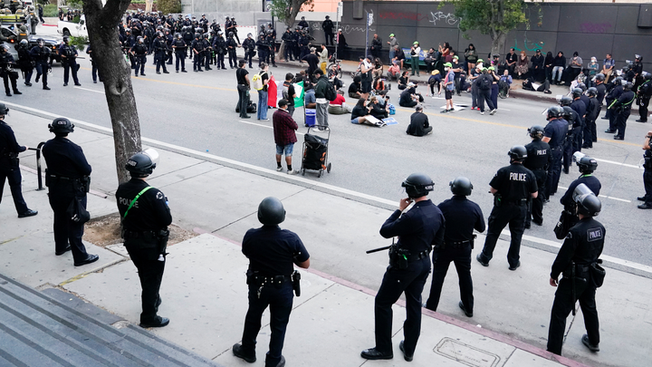 police circling people in street - Fox News