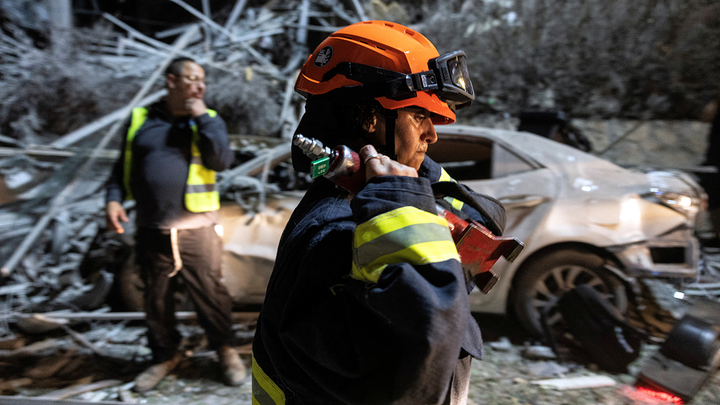 israel-iran-2-rescue-workers-wrecked-car - Fox News