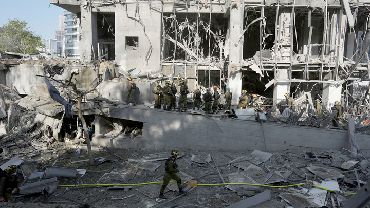 workers gathered in rubble - Fox News