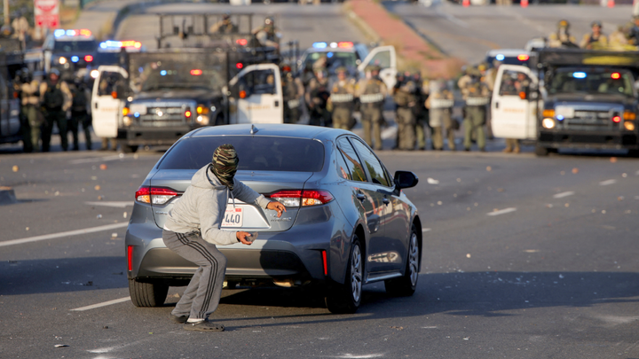 Agitator throwing rock - Fox News