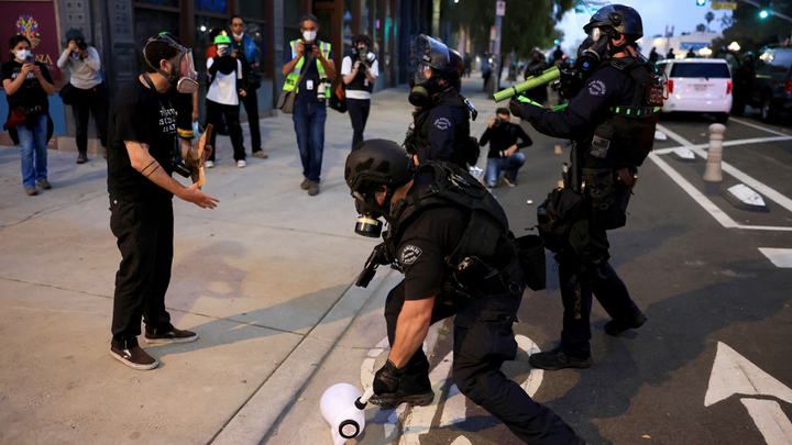 officers with masks - Fox News