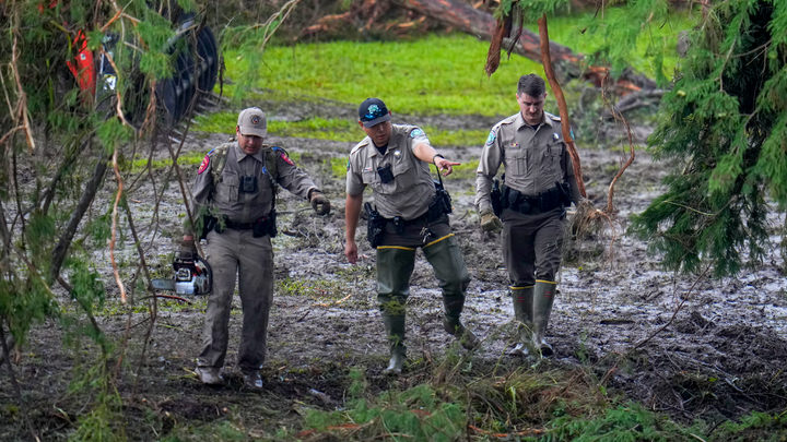 Men surveying damage - Fox News