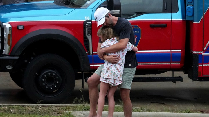 man hugs girl - Fox News