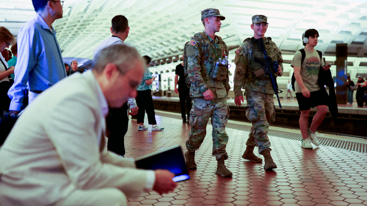 guards at station, man sitting left corner - Fox News
