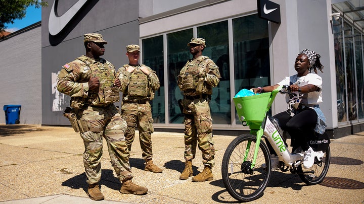Three National Guard women and bike - Fox News