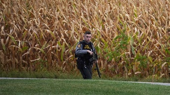 officer in front of field - Fox News