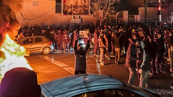 holding a sign - Fox News