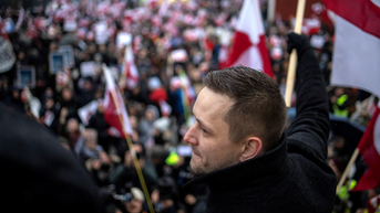 Man looking to the left in front of crowd - Fox News