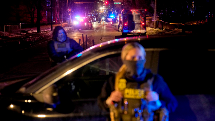 2 officers, ambulance in back - Fox News