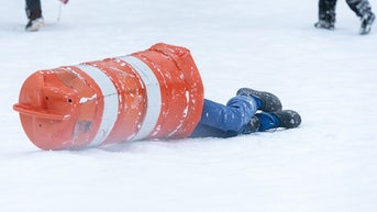 kid in road cone - Fox News