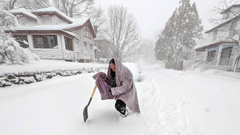 Blanketed woman shoveling snow - Fox News