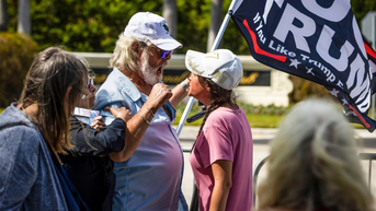 Bodycam footage shows anti-Trump protestor hitting woman wearing Trump hat with a flagpole - Fox News