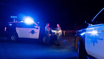 blue cop cars, 2 officers - Fox News