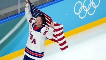 holding up flag - Fox News