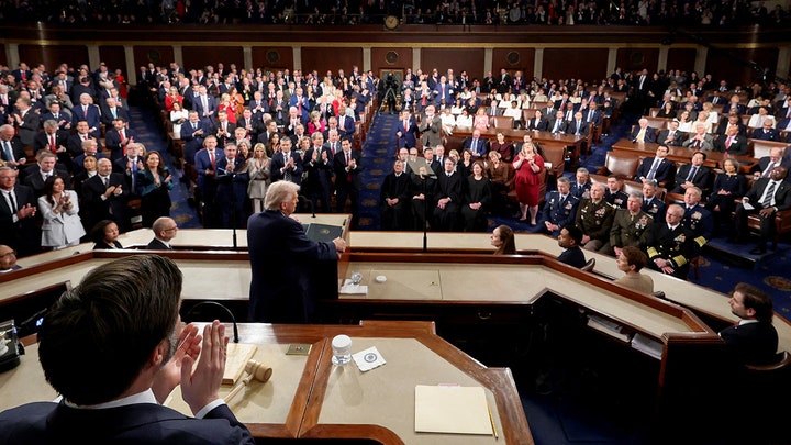 Behind Trump at podium - Fox News