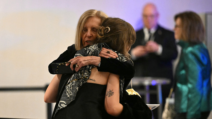 guests hugging - Fox News