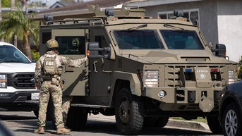 swat member with armored vehicle - Fox News