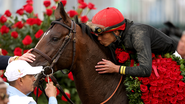Jockey kissing horse - Fox News