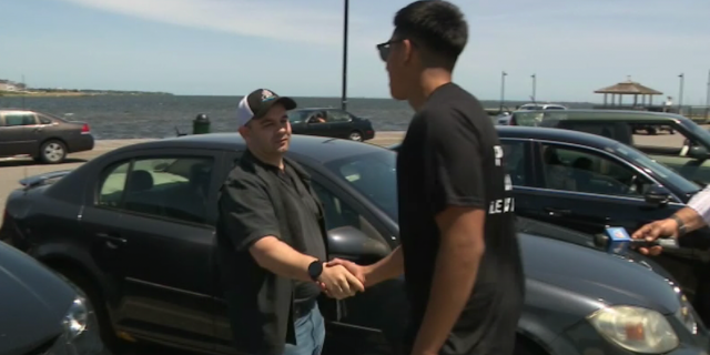 Charles Samolinski, the father of the woman who drove into the water, meets with Anthony Zhongor to thank him for saving his daughter's life.