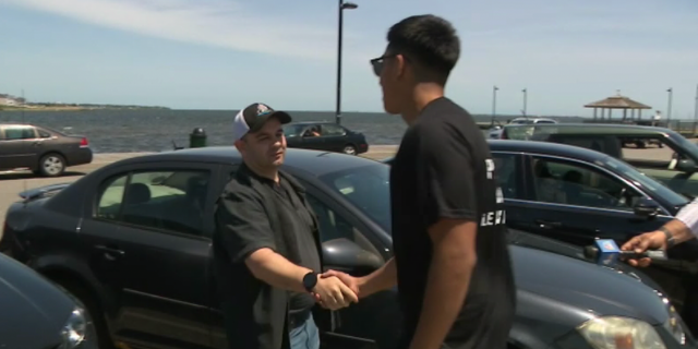 Charles Samolinski, the father of the woman who drove into the water, meets with Anthony Zhongor to thank him for saving his daughter's life.